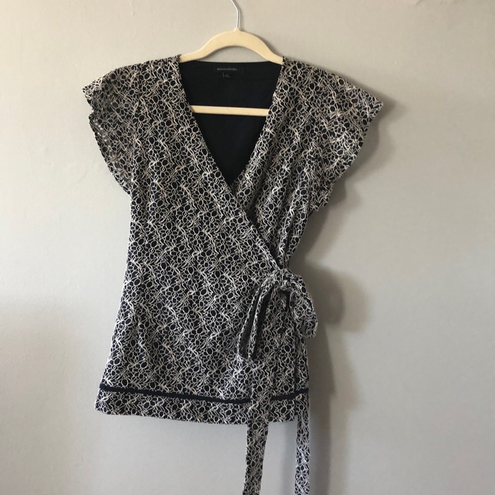 Navy & white wrap blouse w intricate floral design
